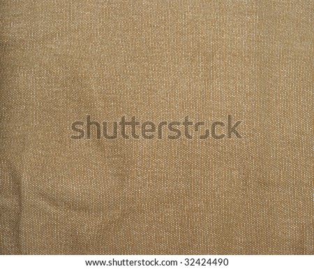Textured background of a sandy brown burlap