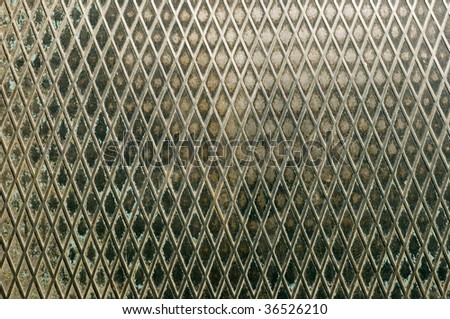Rusty metal texture or background with diamond pattern