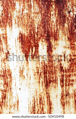 Plate of metal rusty on all background, with traces of a paint