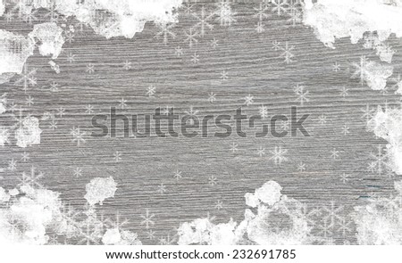 Old wooden background with snow for design. Christmas background