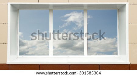 a window in the house, the sky clouds in a glass
