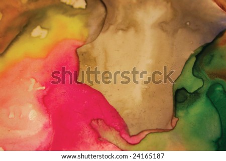 Closeup of artist\'s watercolor palette with green,red  and brown paint splashes