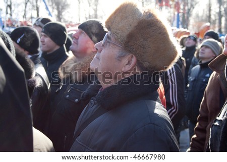 PENZA, RUSSIA - February 14: Celebration of Shrovetide - traditional russian holiday - which signify end of winter  , crowd see to the man   February 14 ,2010 in Penza Russia