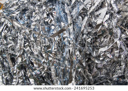 Close up of huge pile of aluminum foils as industrial waste concept
