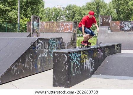 Skateboarder doing a skateboard trick at skateboard park