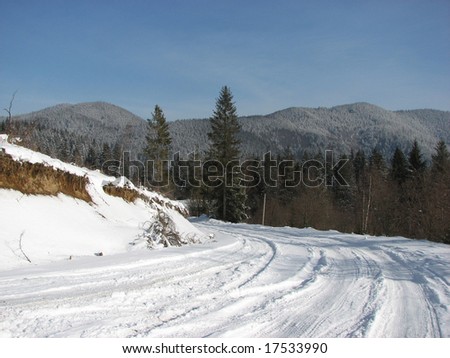 Turning-point of the mountain snow-covered road in the Carpathians