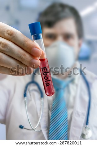 Doctor is holding test tube and developing cure for ebola virus in laboratory