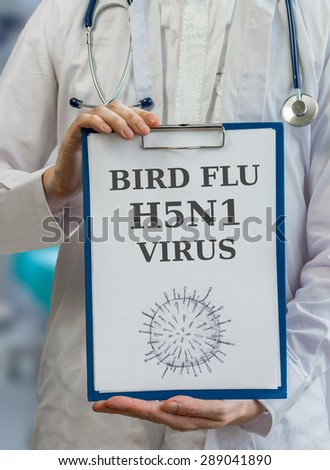 Doctor is warning against bird flu H5N1 virus written on clipboard