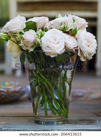bouquet of roses in a vase with water