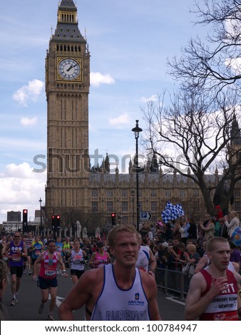 LONDON - APRIL 22: Runners in the London Marathon 2012 pass The Houses of Parliament and Big Ben on April 22, 2012 in London