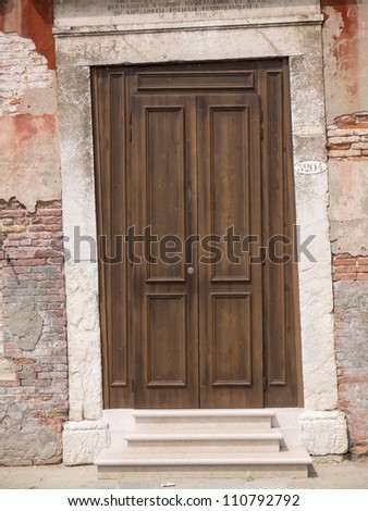 Wooden door fitted into crooked doorpost from 17th century