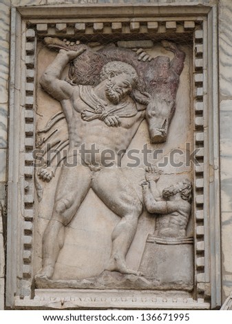 Hercules and the boar of Erymanthus bas-relief on the facade of St. Marks\'s Basilica in Venice