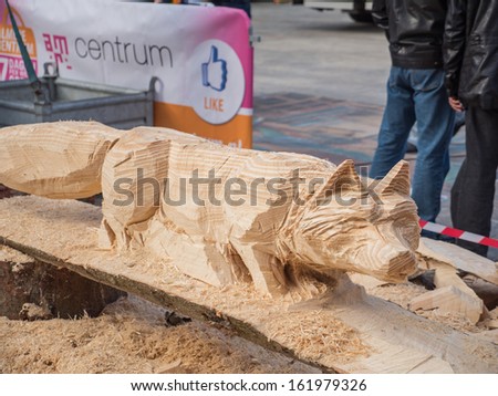 ALMERE, NETHERLANDS - OCT. 26: Wooden fox sculpture made by an artist at the annual Sculpture Festival being held in the townsquare of Almere on October 26, 2013