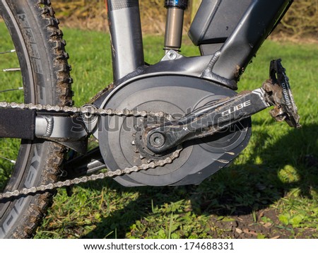 ALMERE, NETHERLANDS - FEB. 3, 2014: Photo of the motor and other details of a state of the art Cube electric powered mountainbike which uses a Bosch motor and provides a smooth ride on rough terrain