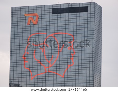 ROTTERDAM, NETHERLANDS - 17 AUGUST 2013: Office building in Rotterdam shows the portraits of Queen Beatrix and future king Willem-Alexander to commemorate his inauguration of April 2013