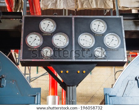 LEMMER, NETHERLANDS - 2 MARCH 2014: Instruments inside the boiler house of the historic Wouda steam pumping station from 1920, the largest of its kind and still in operation.