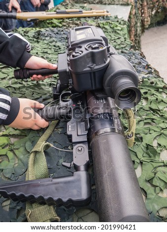 ALMERE, NETHERLANDS - 12 APRIL 2014: Machine gun as used by the Dutch military on display and available for kid to touch and hold during the first National Security Day held in the city of Almere