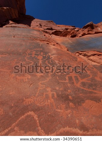 Petroglyphs carved into cliff wall by prehistoric Native American(s), Vermilion Cliffs, northern Arizona, USA.