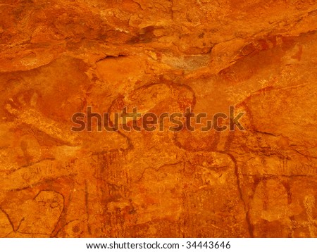 Close up of pictographs painted on cave wall by prehistoric Native American(s), possibly thousands of years old. Remote cave inside Grand Canyon National Park, Arizona, USA.