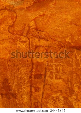 Close up of pictographs painted on cave wall by prehistoric Native American(s), possibly thousands of years old. Remote cave inside Grand Canyon National Park, Arizona, USA.