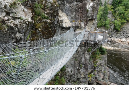 footbridge in Parc de la Caverne Trou de la Fee in Desbiens