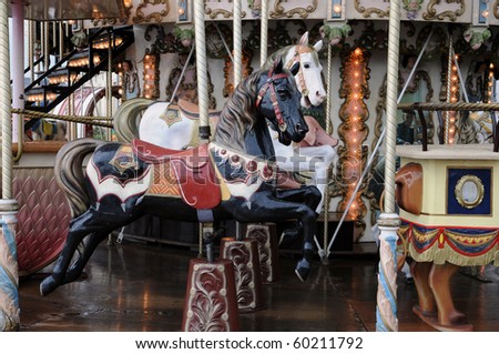 wooden horses on an old carousel
