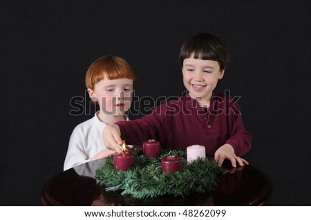 First Week of Advent: Two brothers light an Advent wreath to prepare for Christmas