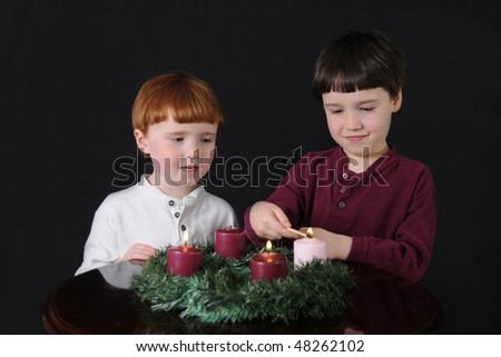 Third Week of Advent: Two brothers light an Advent wreath to prepare for Christmas