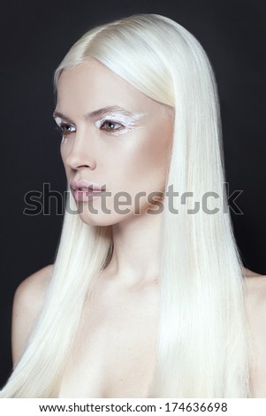 Portrait of beautiful girl with blonde hair close up isolated on black background  Fashion stylish beauty portrait. Professional model. Professional make up.