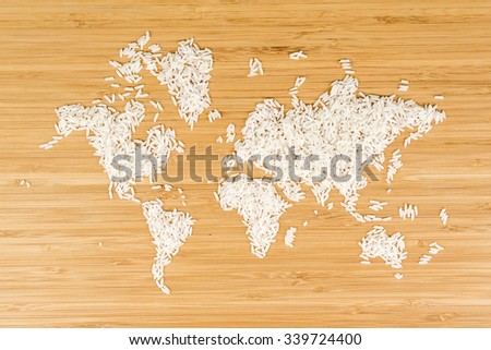map of the world made of white rice on bamboo wood background