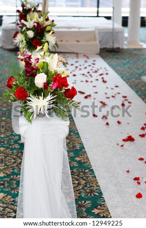 Religious wedding ceremony, nice wedding bouquet is right next to the final aisle to marriage.