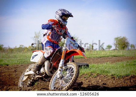 motocross rider on dirt track