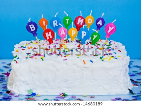 stock photo : cake with happy birthday candles, blue background