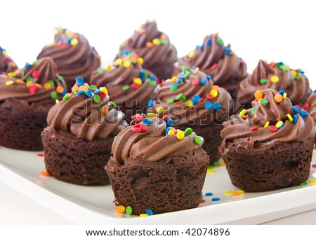 plate of mini cupcake brownies decorated with brightly colored sprinkles