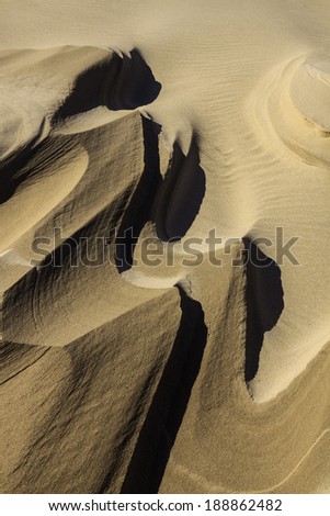 Close up of sculpted sand after summer storm. Silver Lake Sand Dunes along Lake Michigan shoreline, Oceana County, Michigan, USA