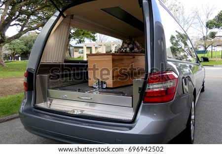 closeup shot of a colorful casket in a hearse or chapel before funeral or burial at cemetery