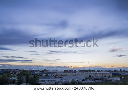 Aerial view of sunset sky over industrial place