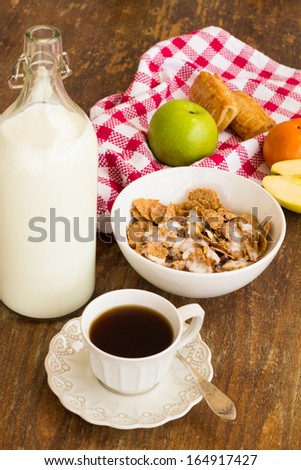 Healthy breakfast with granola, fresh fruits, nuts and milk.