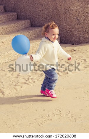 Cute little girl running down the stairs