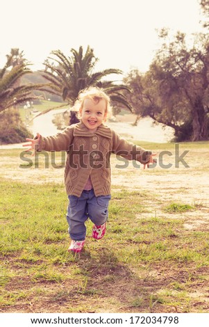Cute little girl playing at park