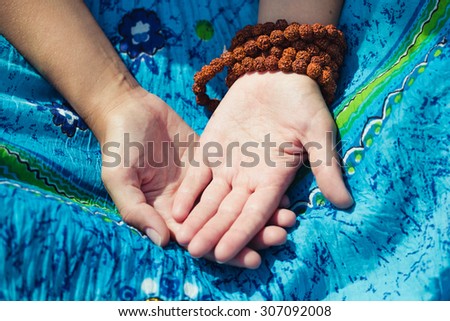 Woman's hands in meditation pose. Outdoor