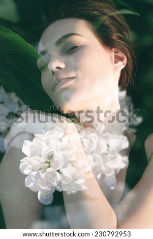 Double exposure portrait of gorgeous lady combined with photograph if lilac flowers in a tender composition