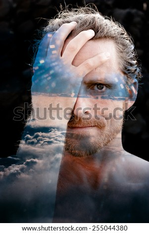 Double exposure portrait combined with phtotograph of clouds taken from plane