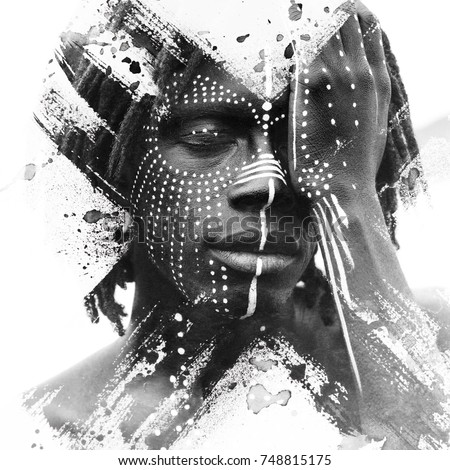 Paintography. African man with traditional style face paint dissolving behind smoky and ink texture