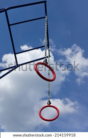 Rings for athletics training on background of cloudy sky