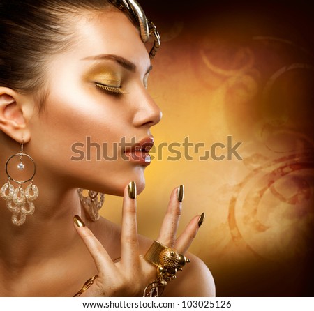 Gold Makeup.Fashion Girl Portrait