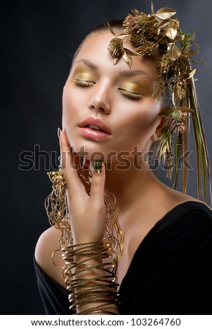Golden Makeup and Jewelry.Fashion Model Portrait