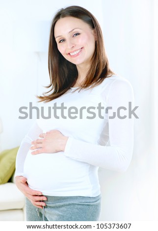 Pregnant Young Woman at home. Healthy Pregnancy. Mother