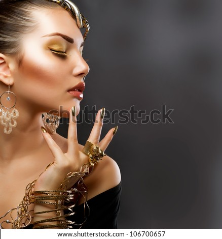 Fashion Girl Portrait. Golden Makeup.