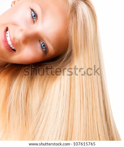 Beautiful Blond Smiling Girl. Blonde Woman with Blue Eyes. Healthy Long Blond Hair.